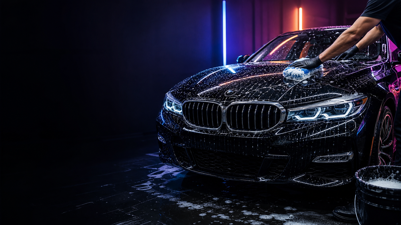 BMW noire en cours de nettoyage professionnel par WM Clean Solution